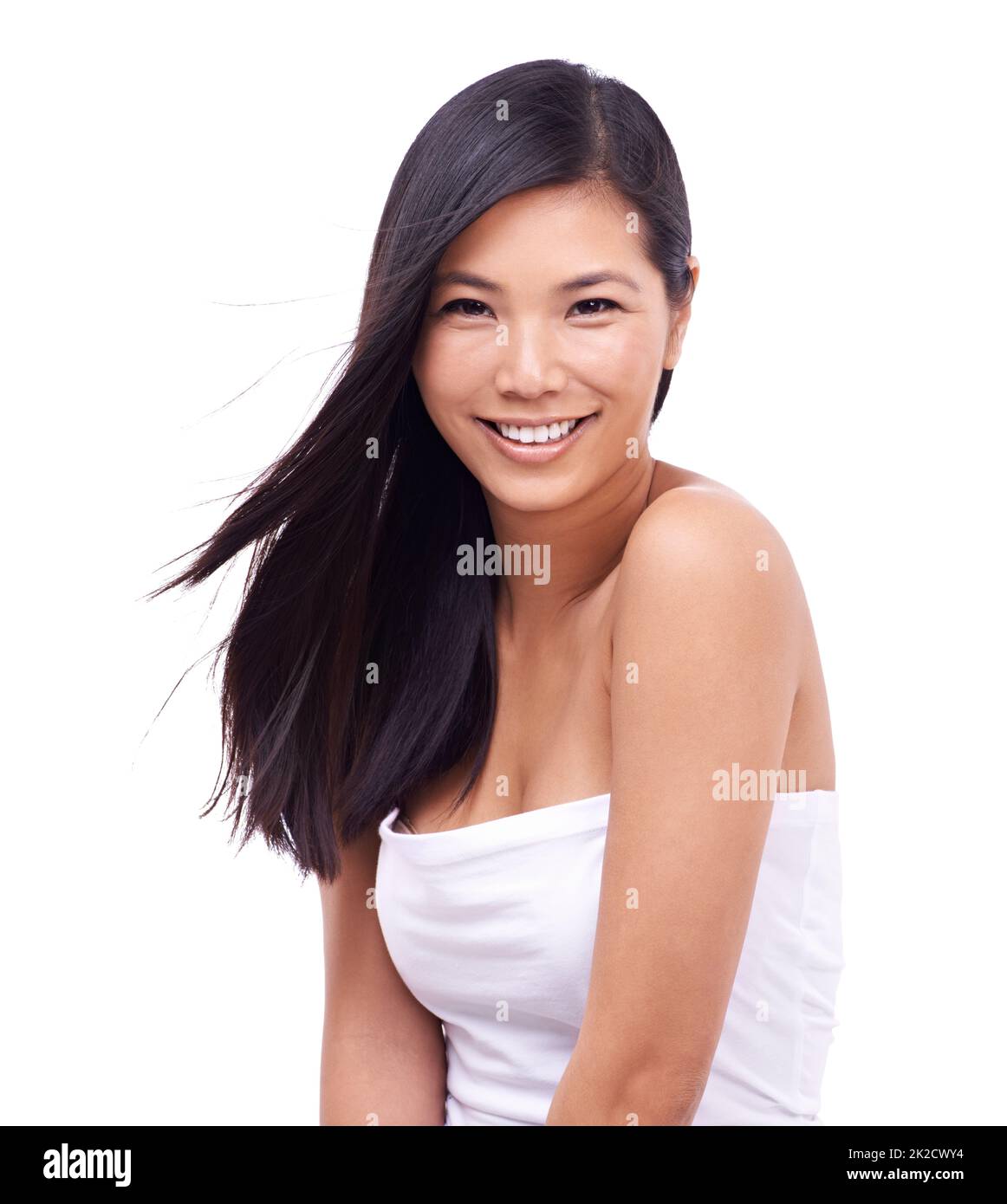 Shes glowing. Cropped shot of a beautiful young oriental woman against a white background. Stock Photo