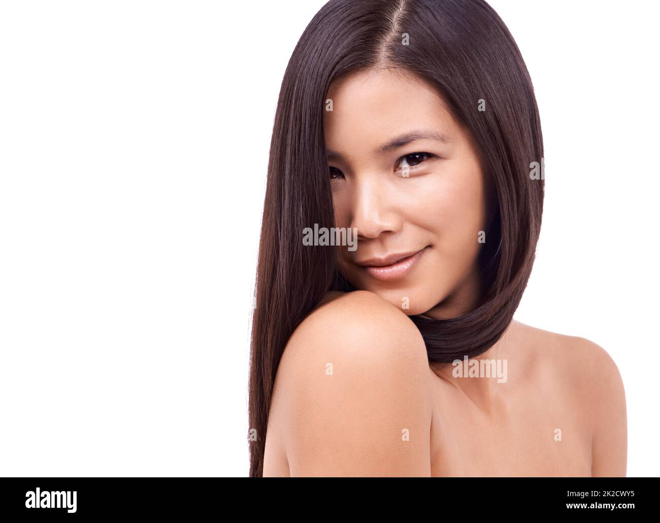 Naturally gorgeous. Cropped shot of a beautiful young oriental woman against a white background. Stock Photo