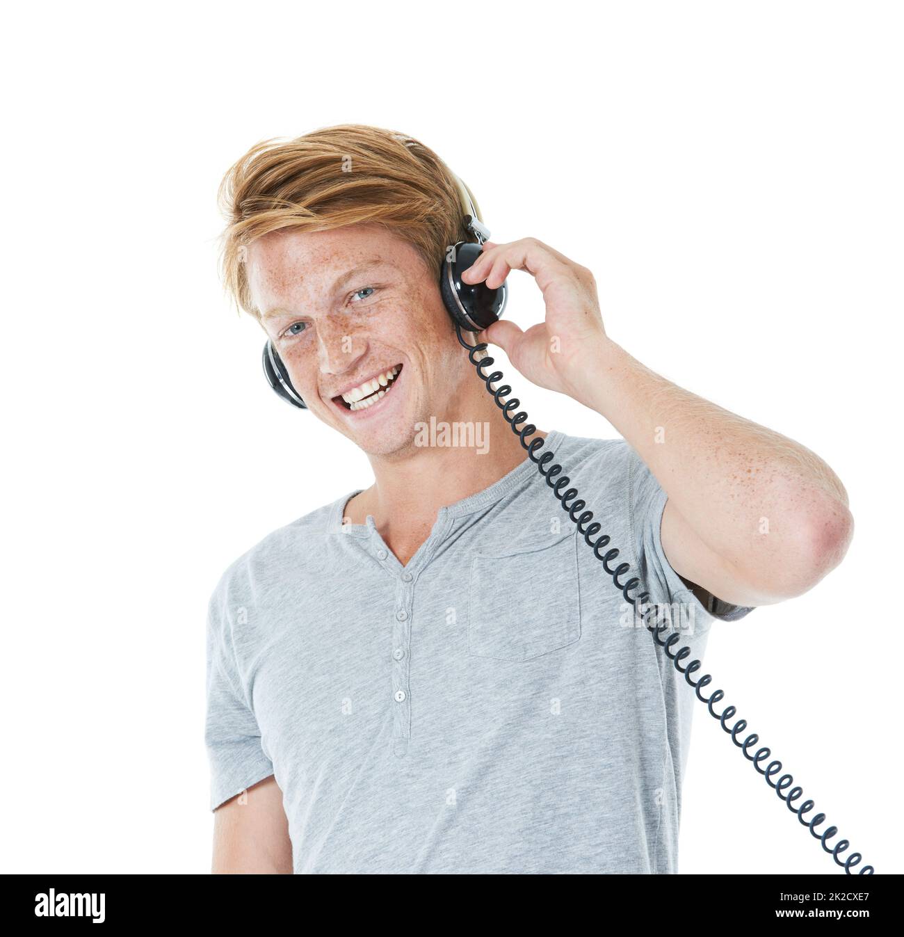 Feeling confident and looking casual. Studio portrait of a handsome young man with ginger hair. Stock Photo