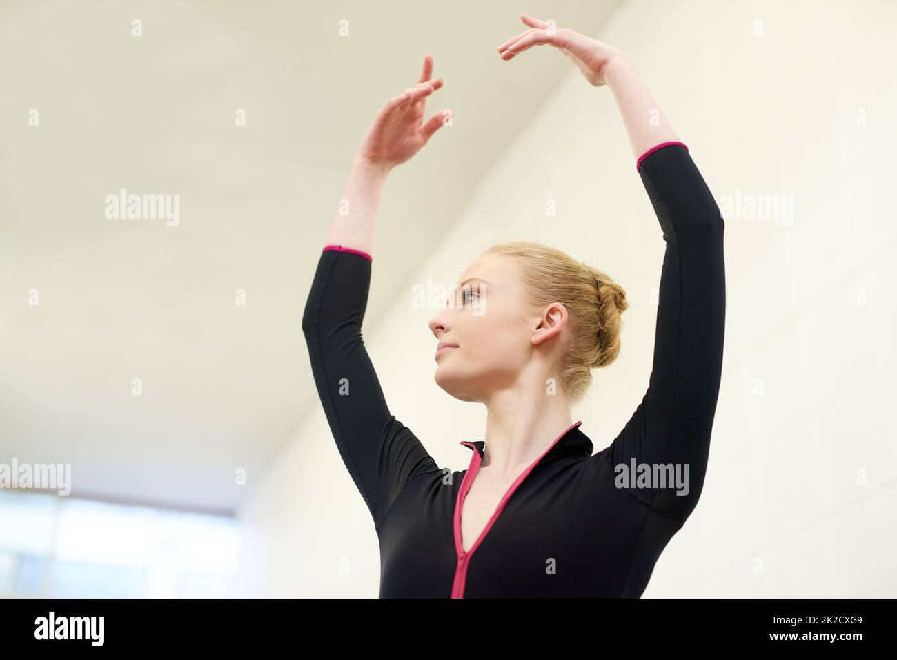 Her fifth position is flawless. Shot of a young woman practising ballet. Stock Photo