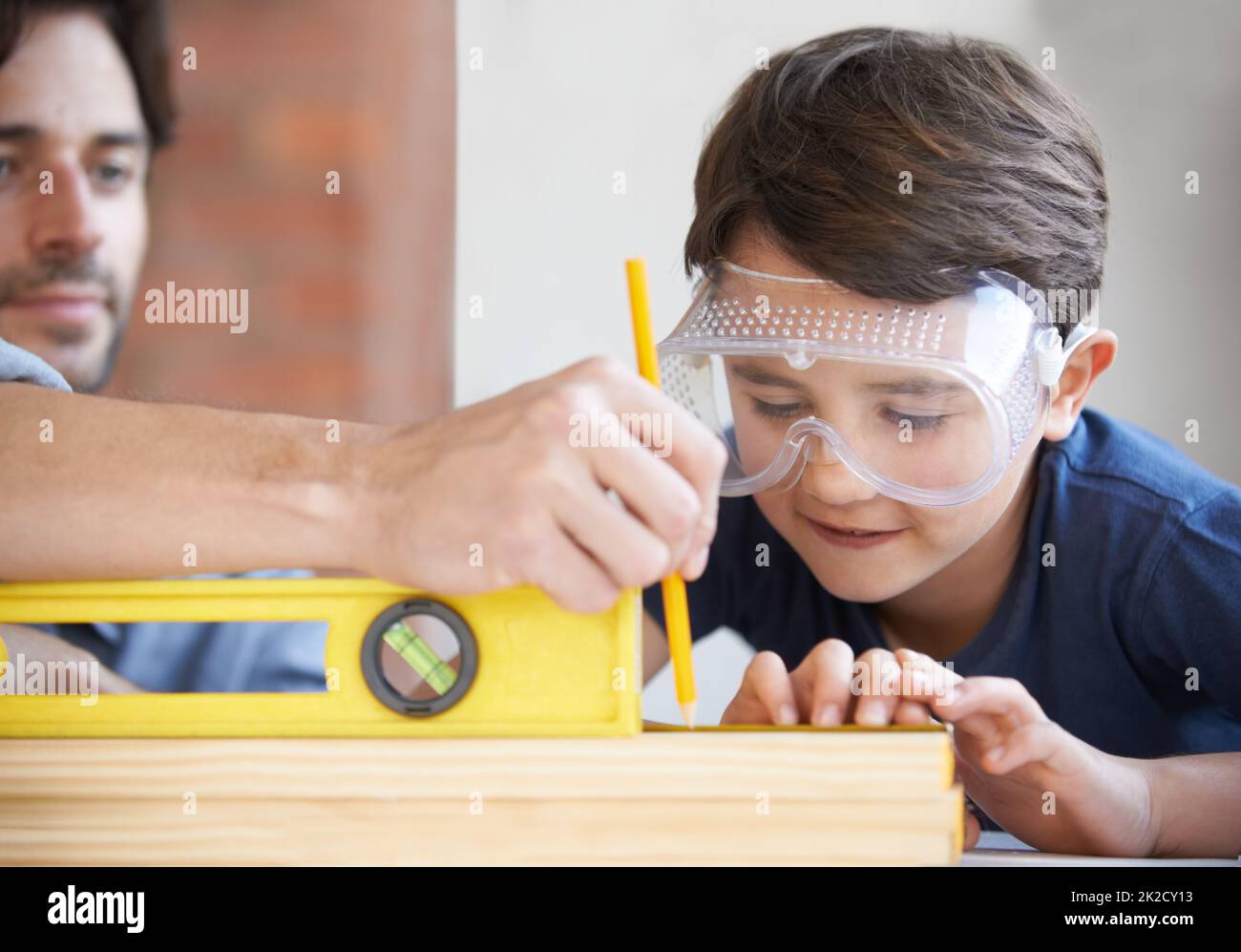 Carpentry is a family profession. A father and son doing woodwork