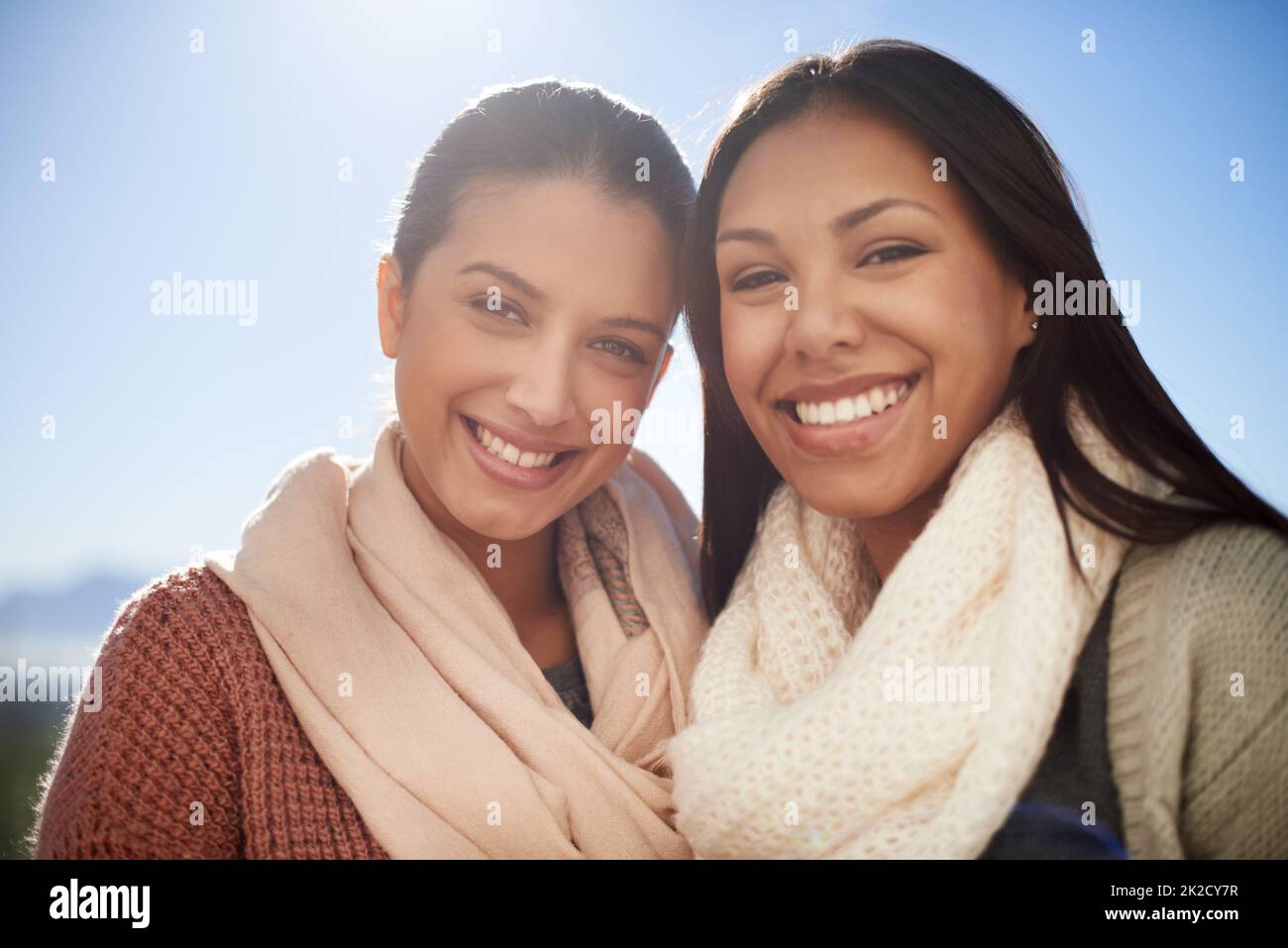 Our friendship is built to last. Two young women smiling happily at the camera. Stock Photo