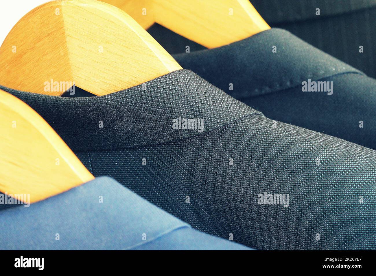 Row of classic men's suits hanging for sale Stock Photo
