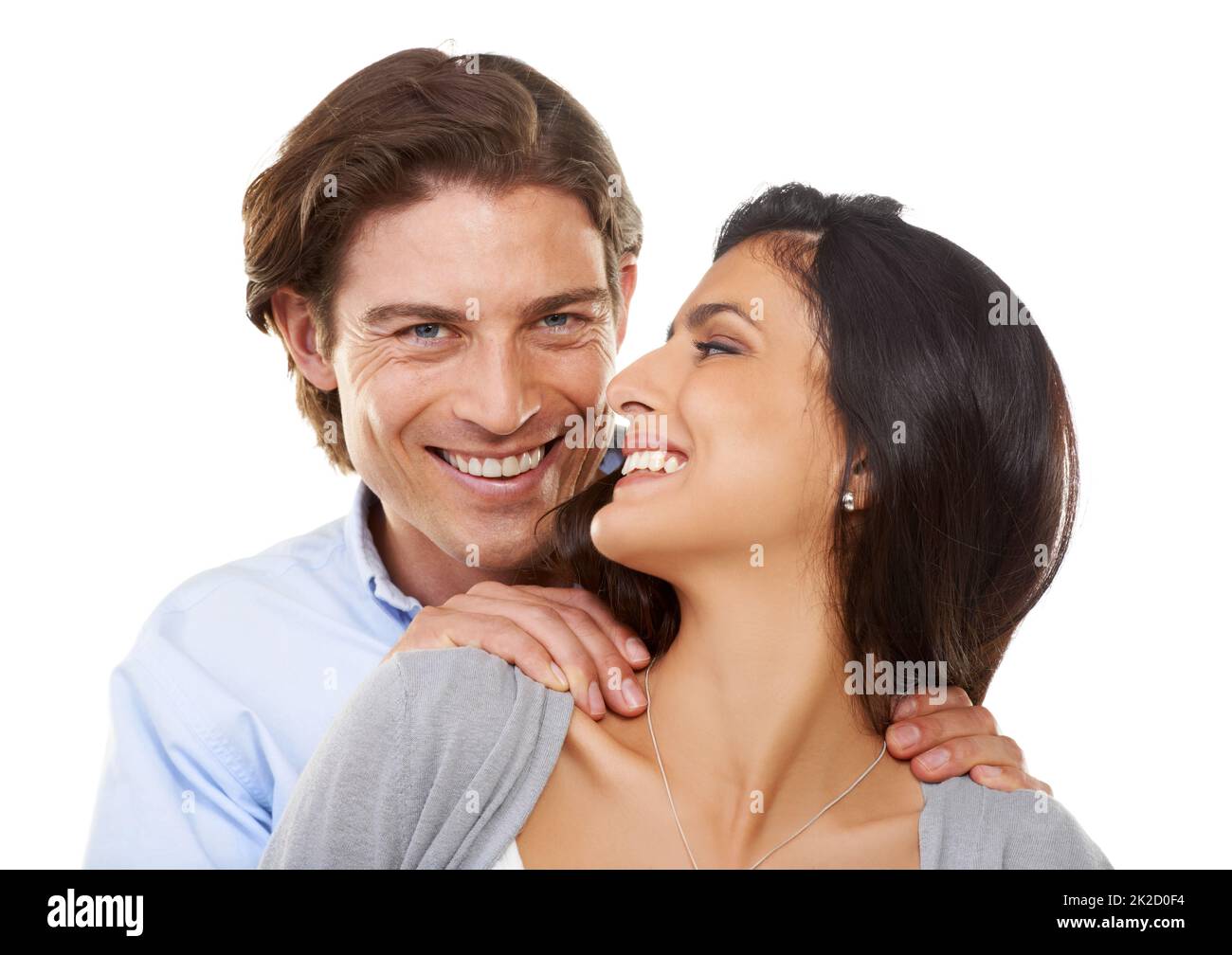 Hes a dream. Head and shoulders portrait of a happy young couple isolated on a white background. Stock Photo