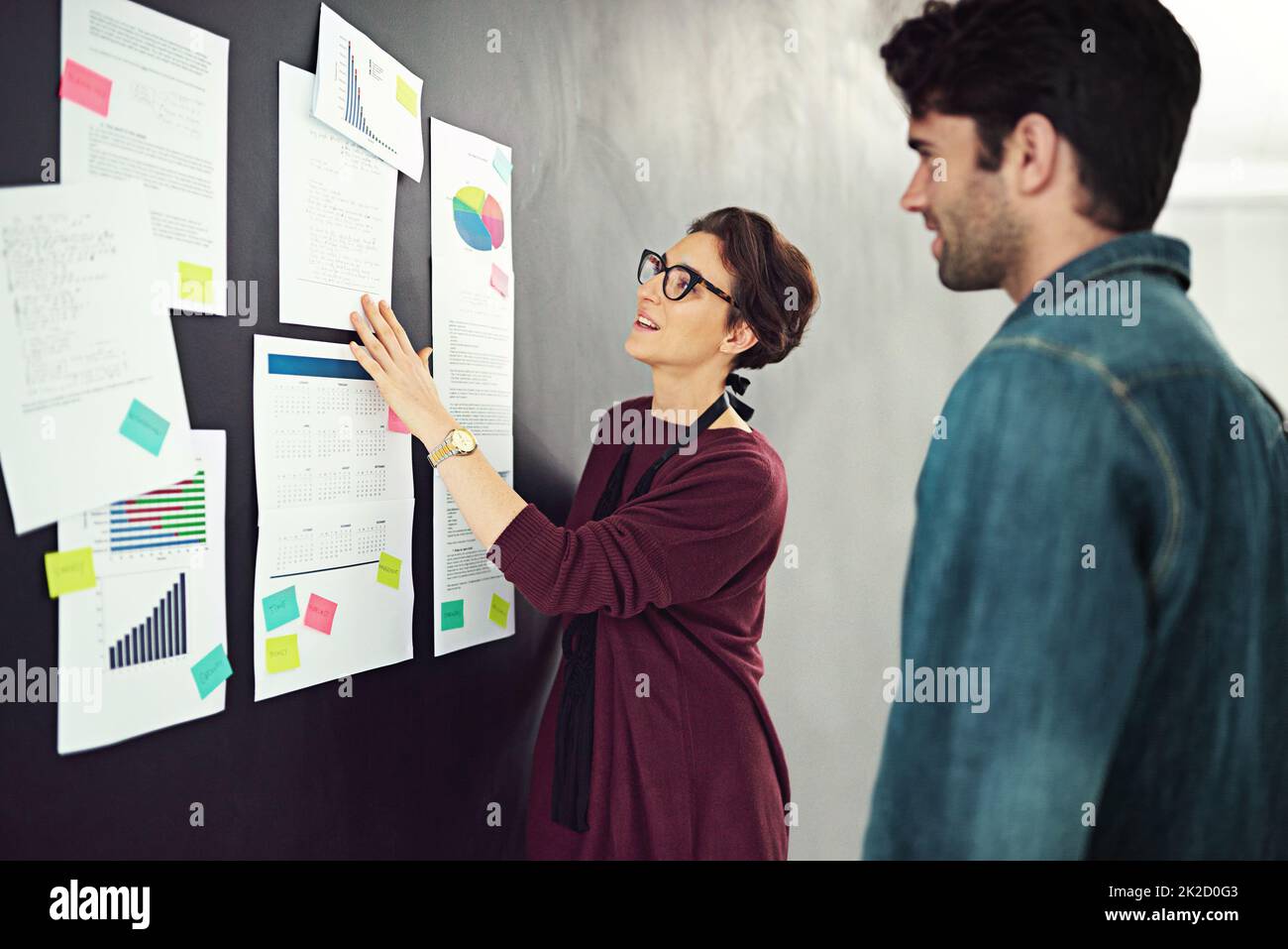 She always presents unfailing plans. Cropped shot of coworkers brainstorming in a modern office. Stock Photo