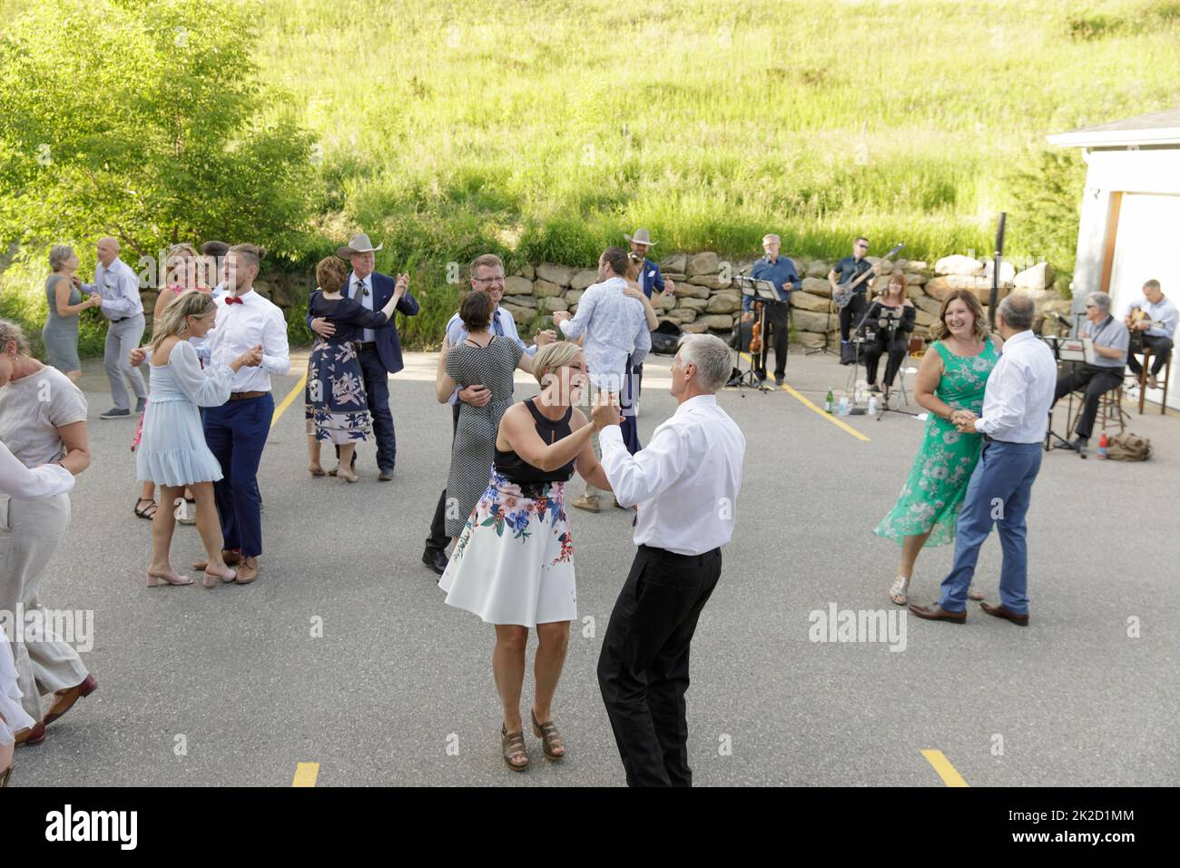 Happy guests dancing in wedding reception parking lot Stock Photo Alamy