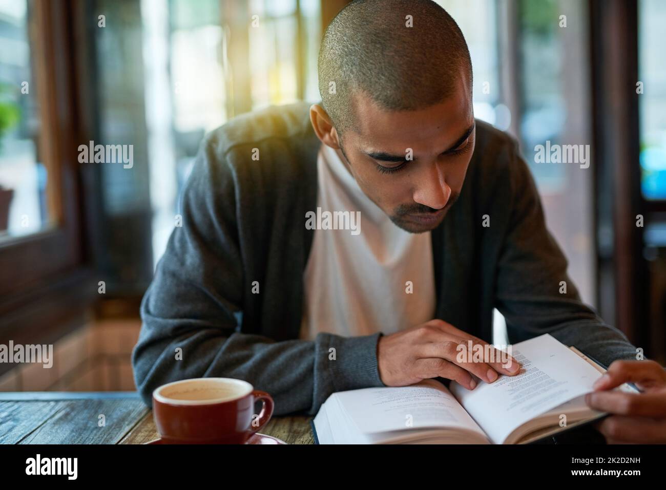 Its his quiet place away from the world. Cropped shot of a young man ...