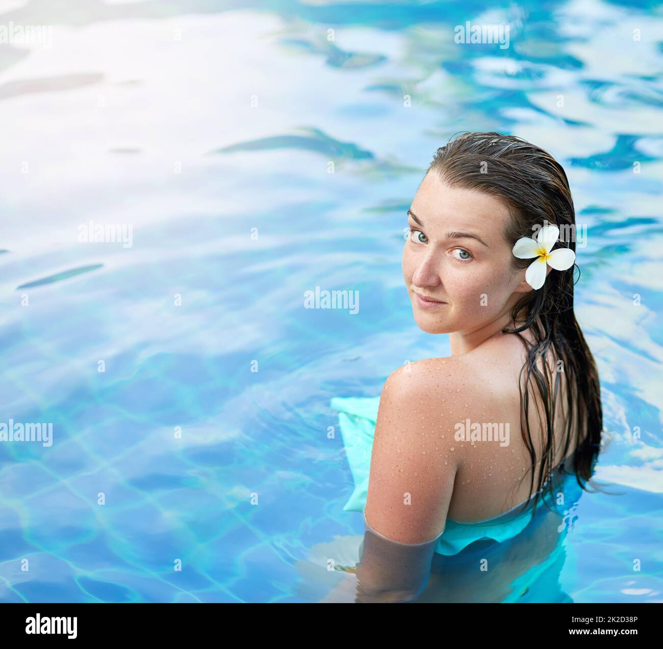 Enjoying a day of leisure and luxury. Portrait of a young woman relaxing in the pool at a spa. Stock Photo