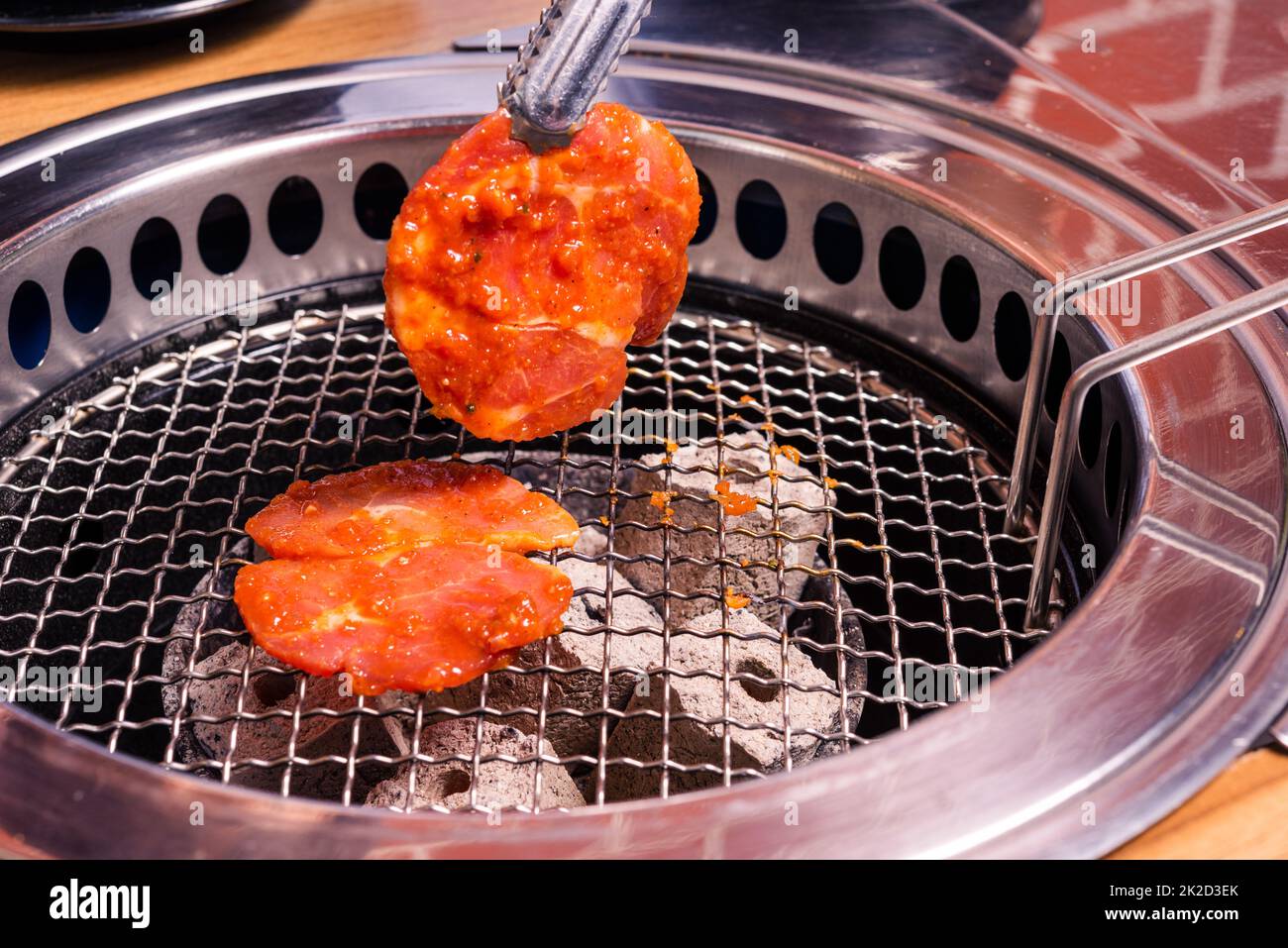 Grilling meat pork Korean BBQ traditional style on stove serve in
