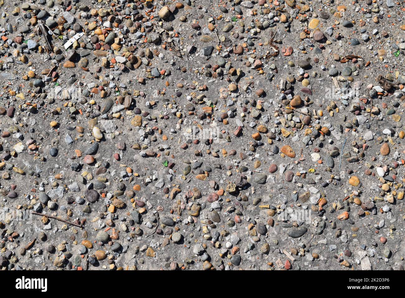 Pellet in old asphalt Stock Photo - Alamy