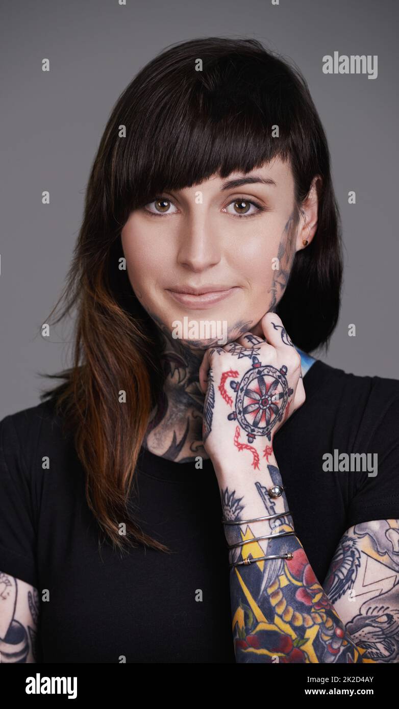 Beauty redefined. A cropped studio portrait of a tattooed young woman. Stock Photo
