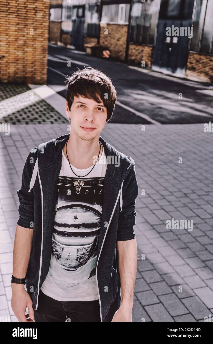 Musican Look Portrait of a young adult rock musician with brown hair Stock Photo - Alamy