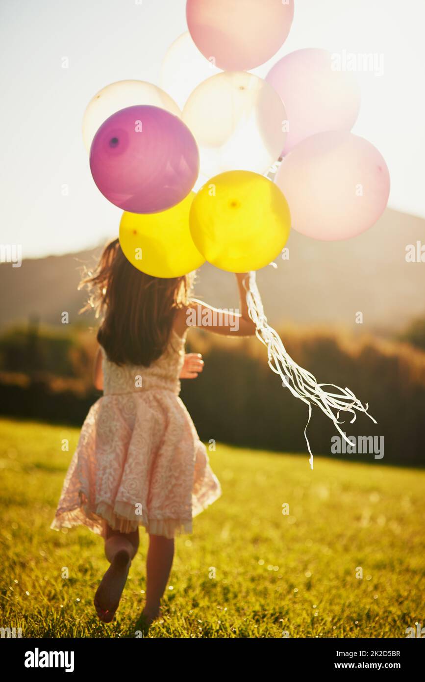 Rear view girl holding bunch hi-res stock photography and images - Alamy