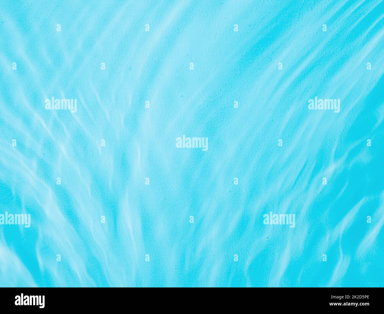 Ripple water texture with shadows on blue Stock Photo