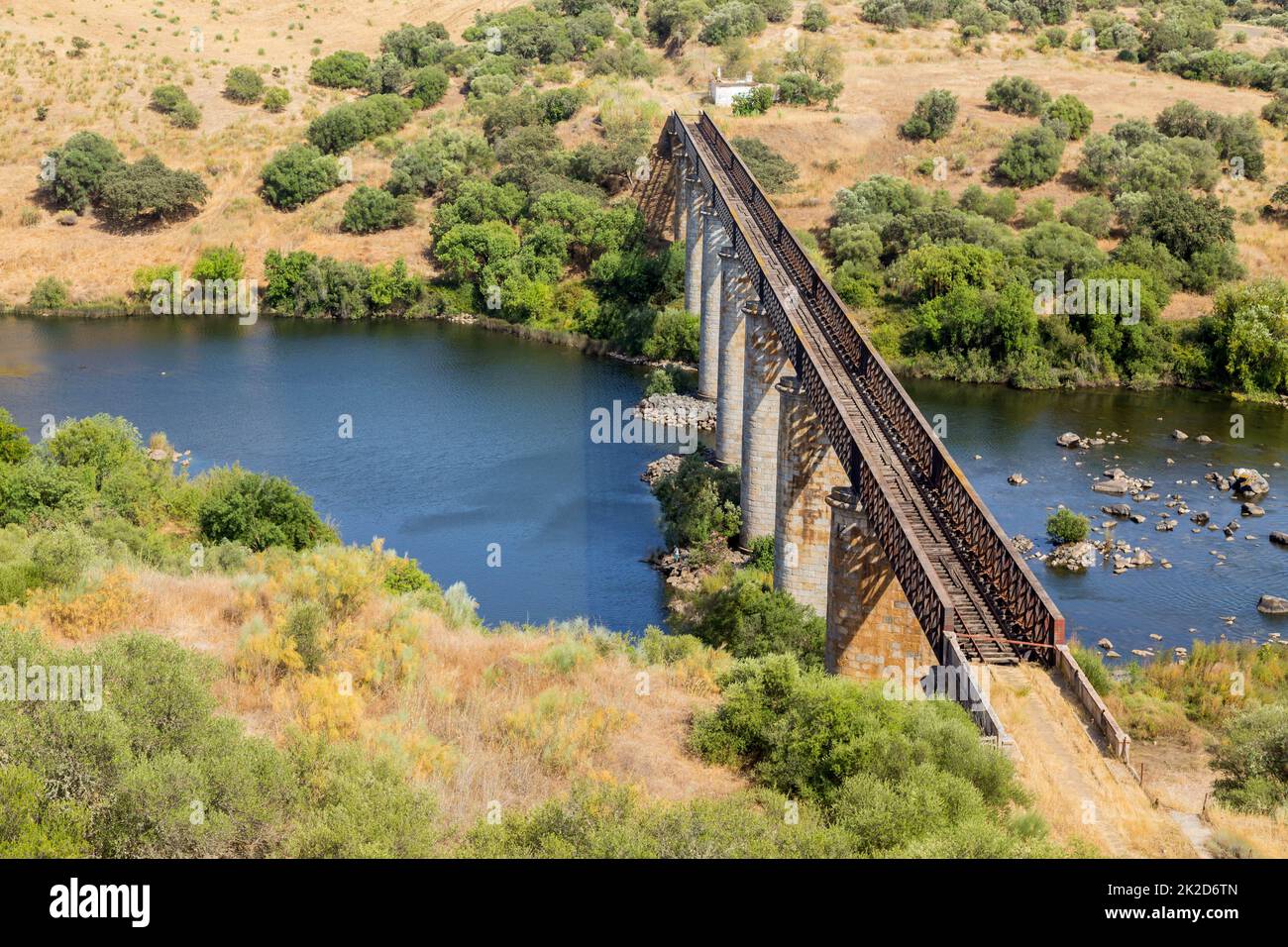 Old train bridge over the Guadiana river Stock Photo