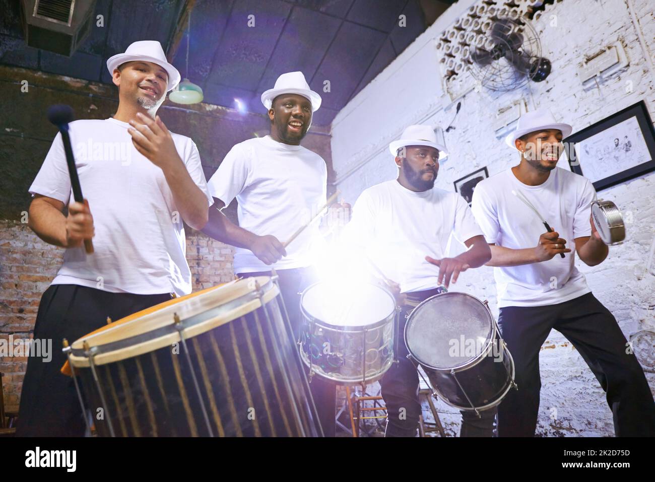 Theyve got the beat that you need. Shot of an ethnic group performing indoors. Stock Photo