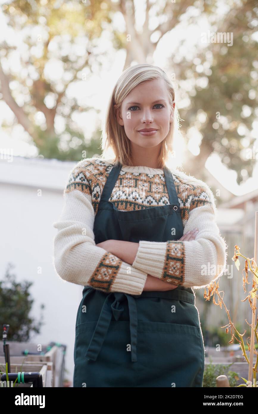 Her healthy hobby. A beautiful young woman busy gardening Stock Photo