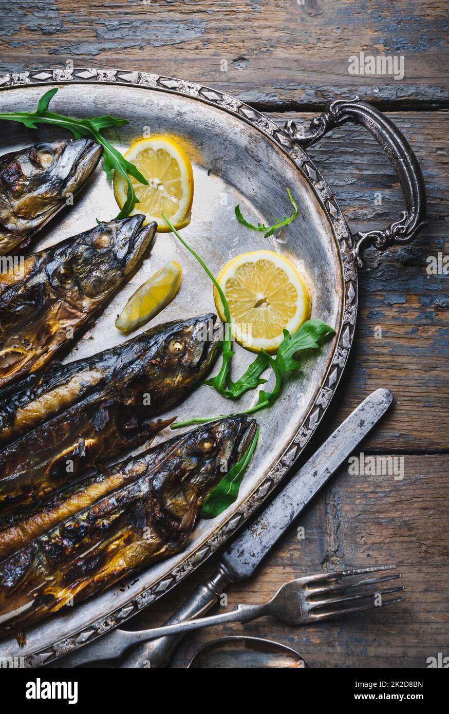 Mackerels on silver plate Stock Photo