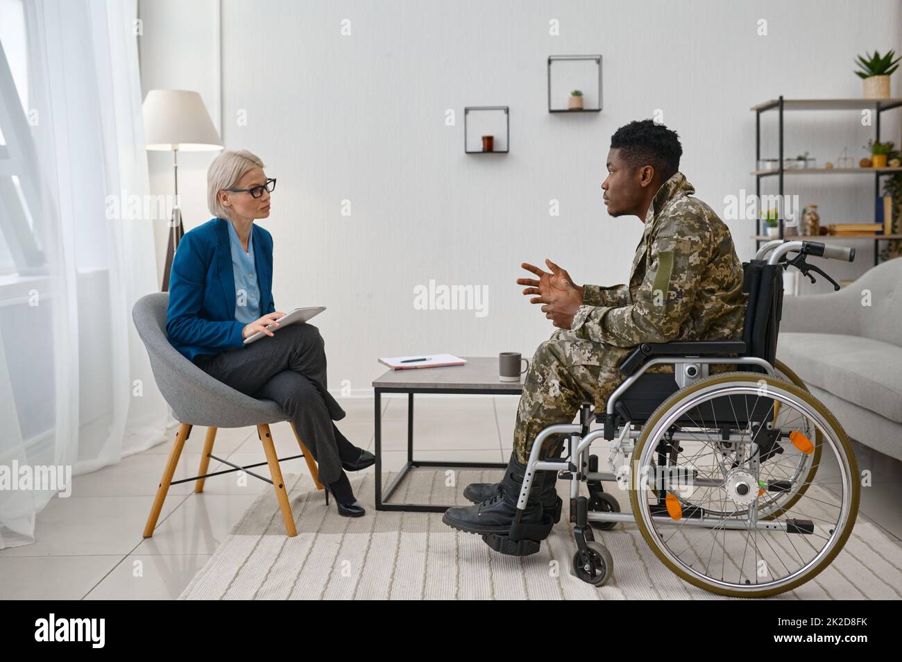 Soldier with disability at professional psychological consultation Stock Photo