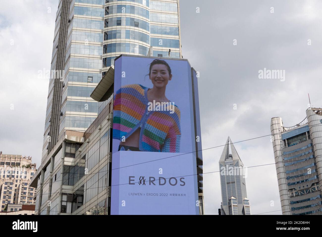 SHANGHAI, CHINA - SEPTEMBER 22, 2022 - An advertisement for Liu Wen wearing an Erdos woolen sweater is seen on a giant LED screen on Nanjing West Road Stock Photo