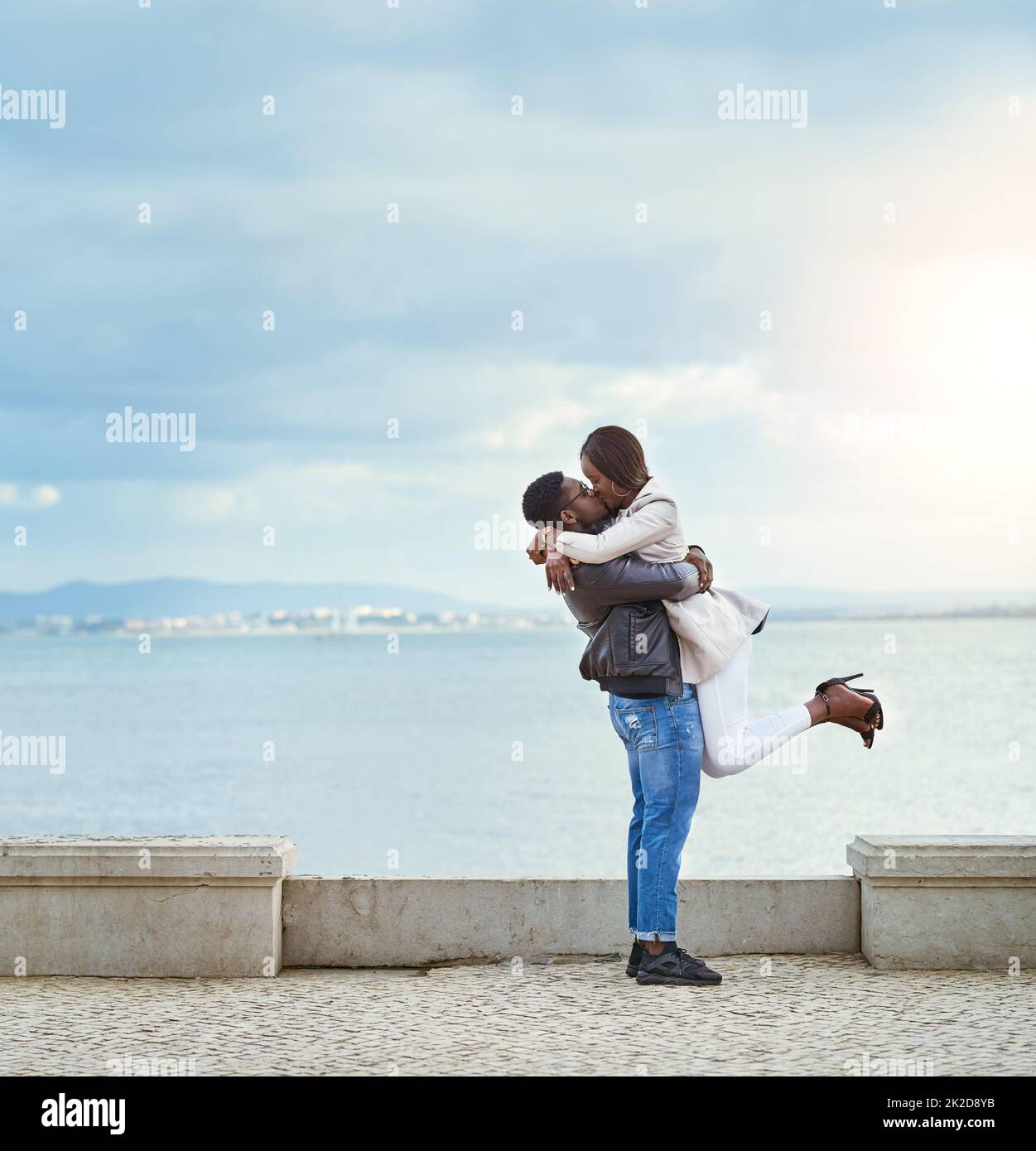 Being with you is bliss. Shot of an affectionate young couple bonding together outdoors. Stock Photo