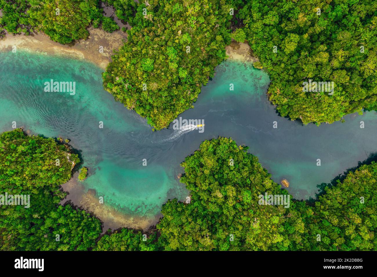 Indonesia is a beautiful place. High angle shot of a little islets and islands in the middle of Indonesia. Stock Photo