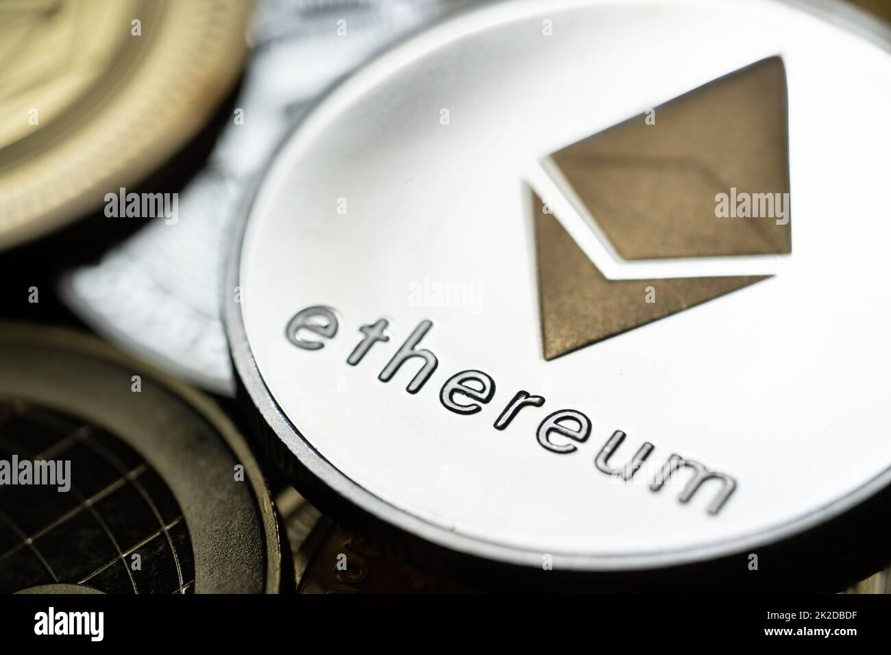 Close up shot of a golden Ethereum digital cryptocurrency. Stock Photo
