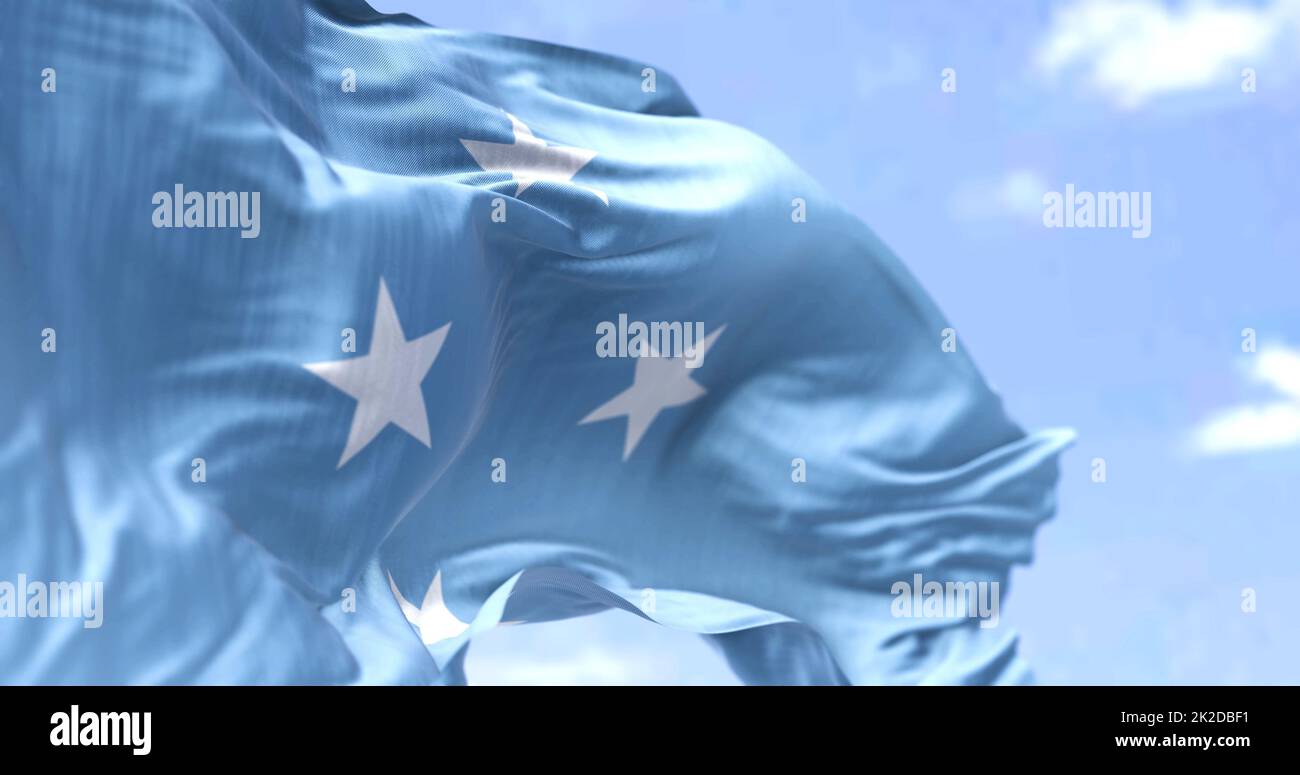 Detail of the national flag of Micronesia waving in the wind on a clear day. Micronesia is an island country in Oceania. Selective focus. Stock Photo