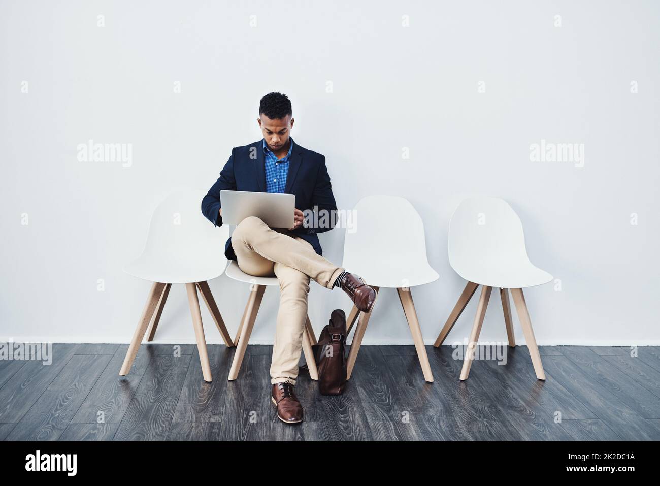 Man sitting chair studio shot hi-res stock photography and images - Alamy
