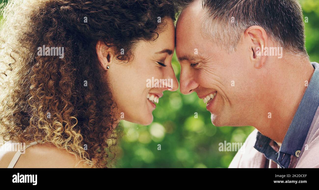 Youre my heaven on earth. Shot of a happy and affectionate mature couple spending quality time together outdoors. Stock Photo