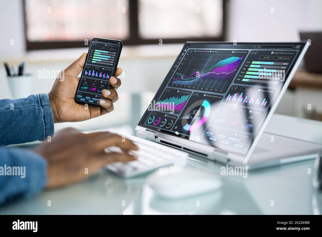 African Advisor Using KPI Dashboard Stock Photo