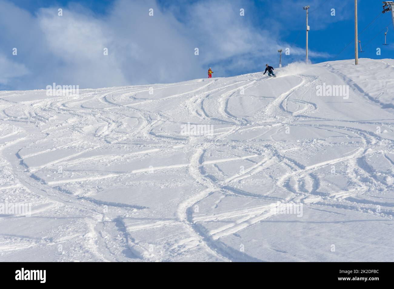 Woman skiing down a snow mountain, norway Stock Photo