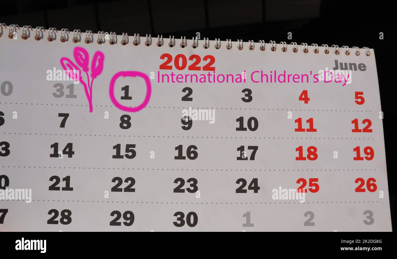Close-up of a page of a paper calendar with a spiral, A reminder of the International Children's Day on June 01, 2022, with a cute children's drawing Stock Photo