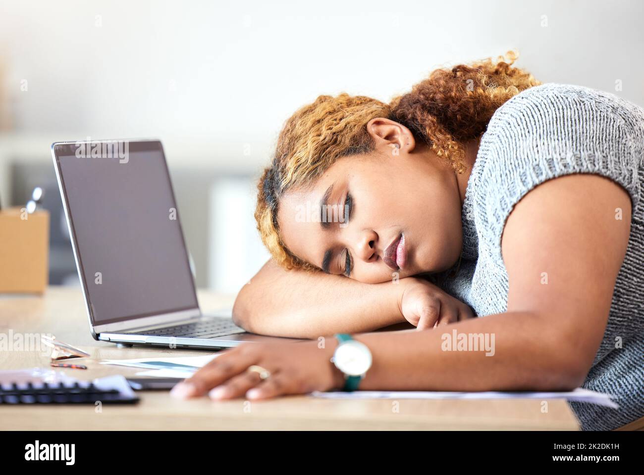 Stress, burnout and sleeping business woman in modern office, workplace and desk. Tired, lazy and frustrated employee, worker and black person in nap Stock Photo