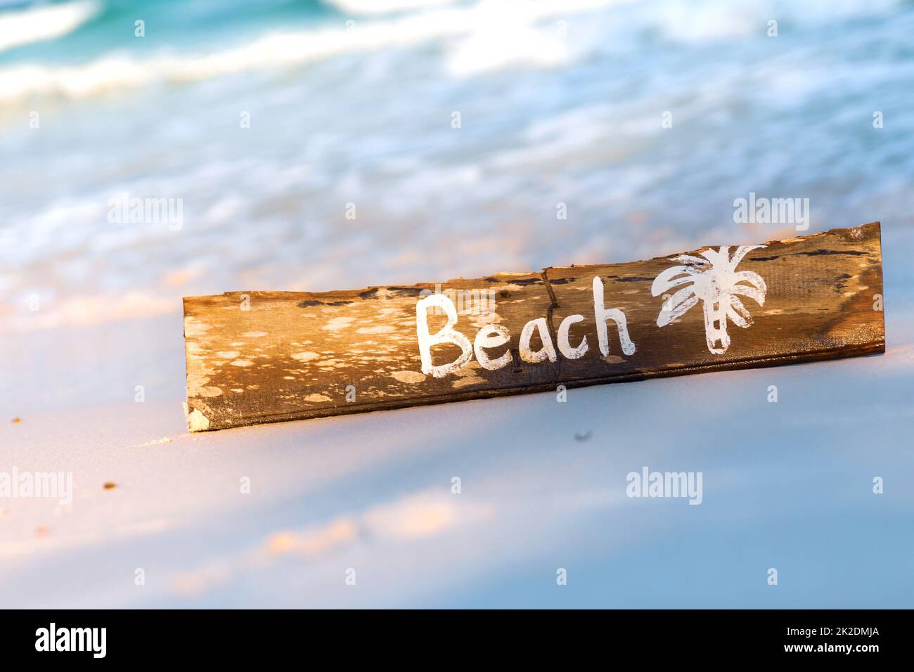 Wooden sign with lettering on the beach Stock Photo - Alamy
