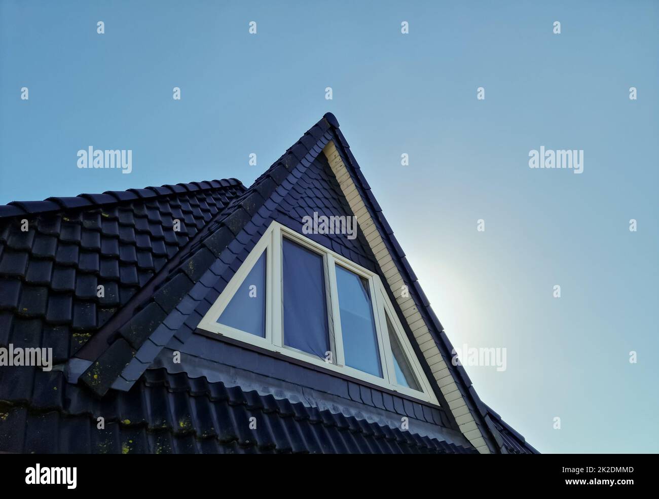 Open roof window in velux style with black roof tiles Stock Photo Alamy