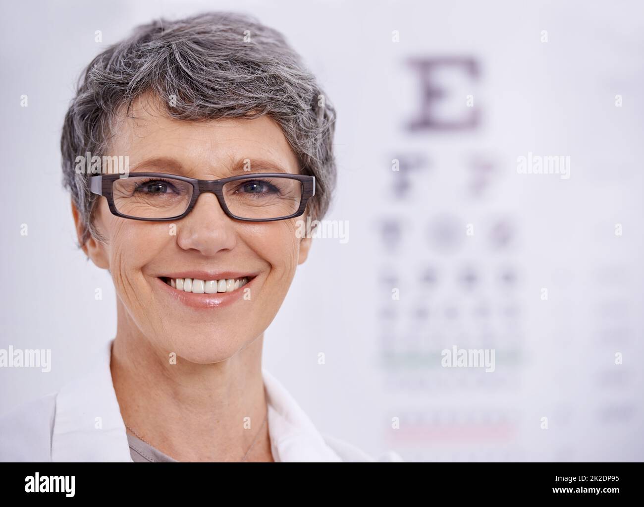 Read from the top down please. Portrait of a female optometrist