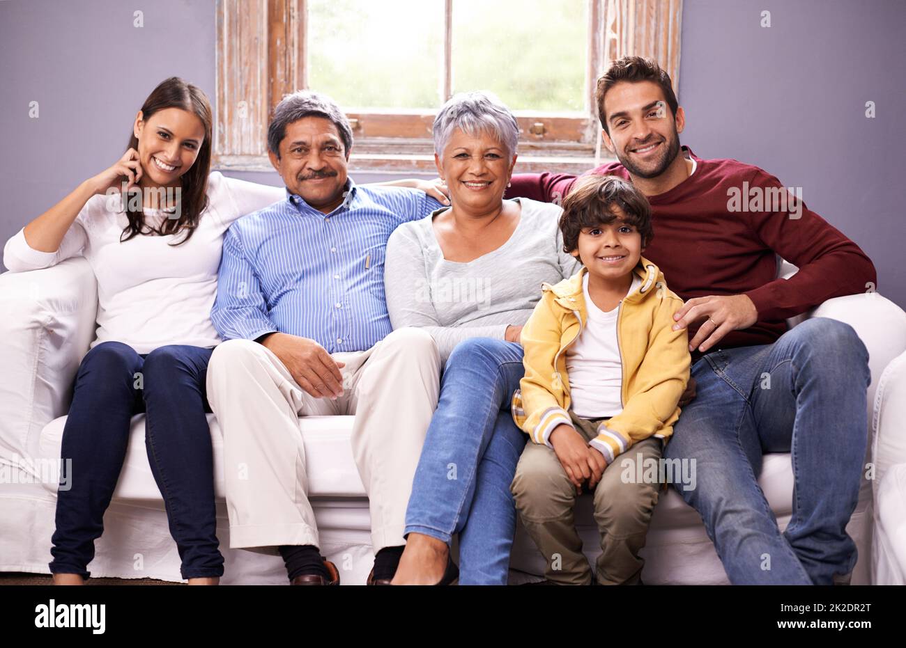 A special family moment. Portrait of a family bonding together in the living room. Stock Photo