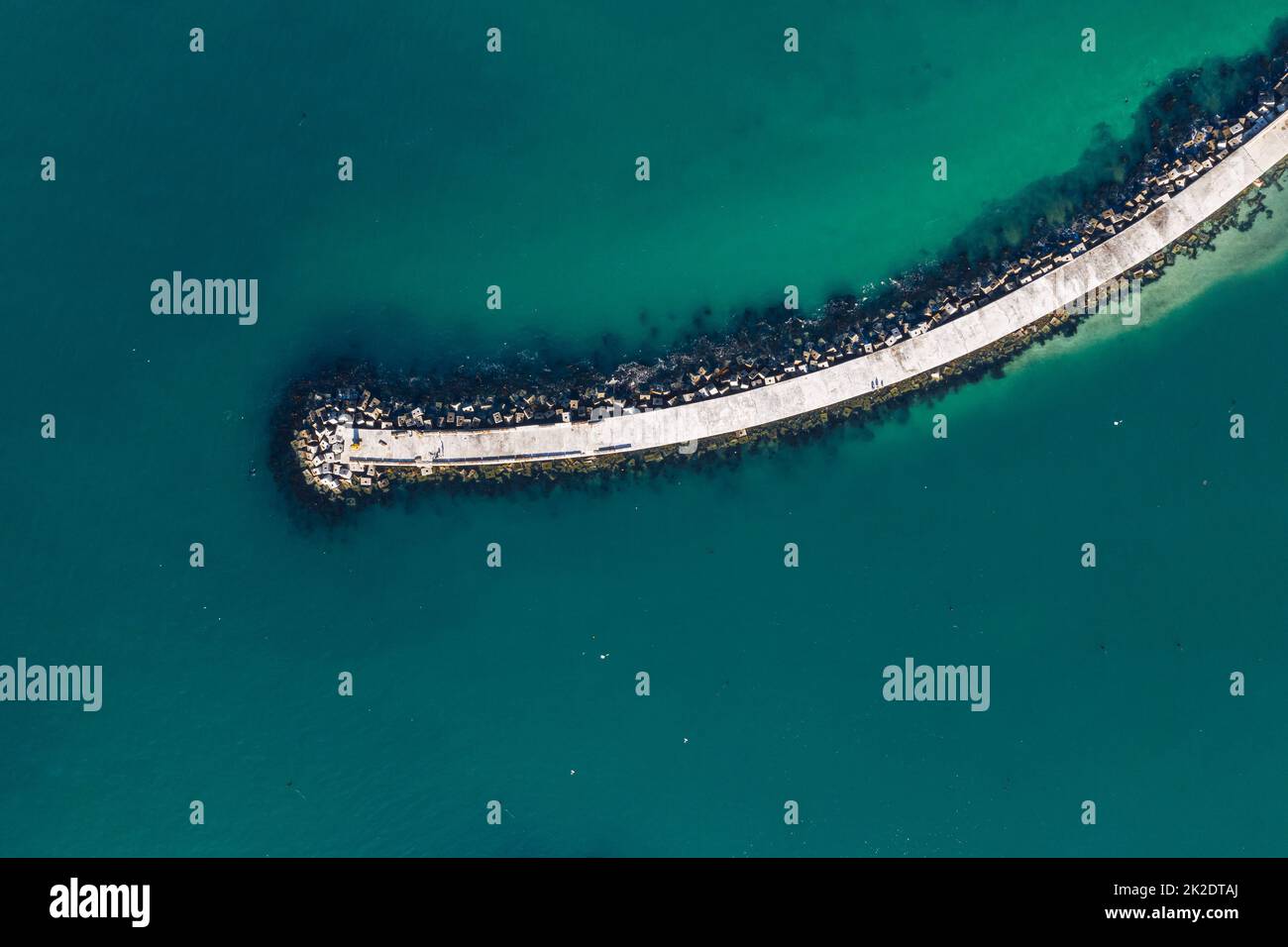 A great place to enjoy the sights from. High angle shot of a pier at sea. Stock Photo