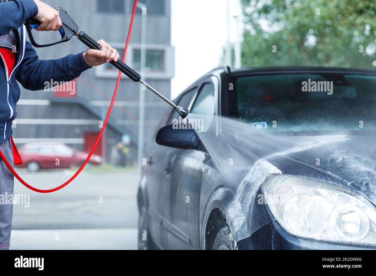 Car wash worker is washing client's car Stock Photo Alamy