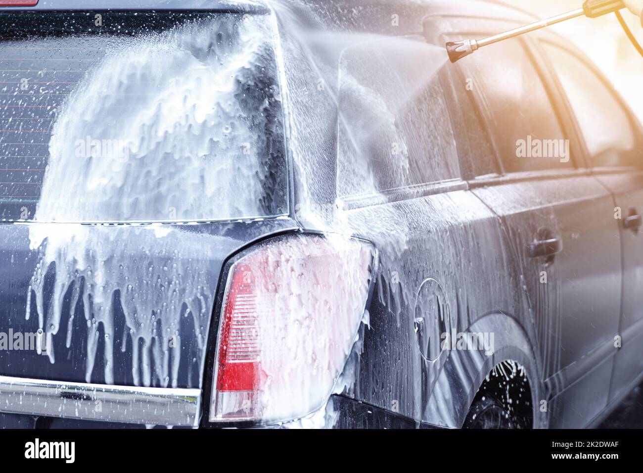 Car wash worker is washing client's car Stock Photo Alamy