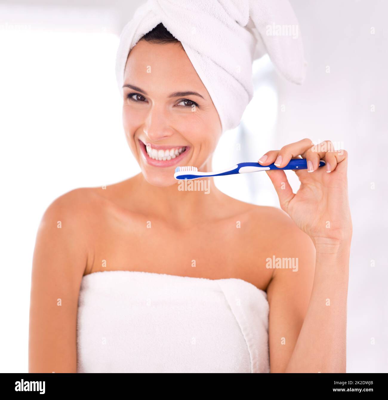 Shiny teeth to match her perfect skin. Portrait of a beautiful woman about to brush her teeth. Stock Photo