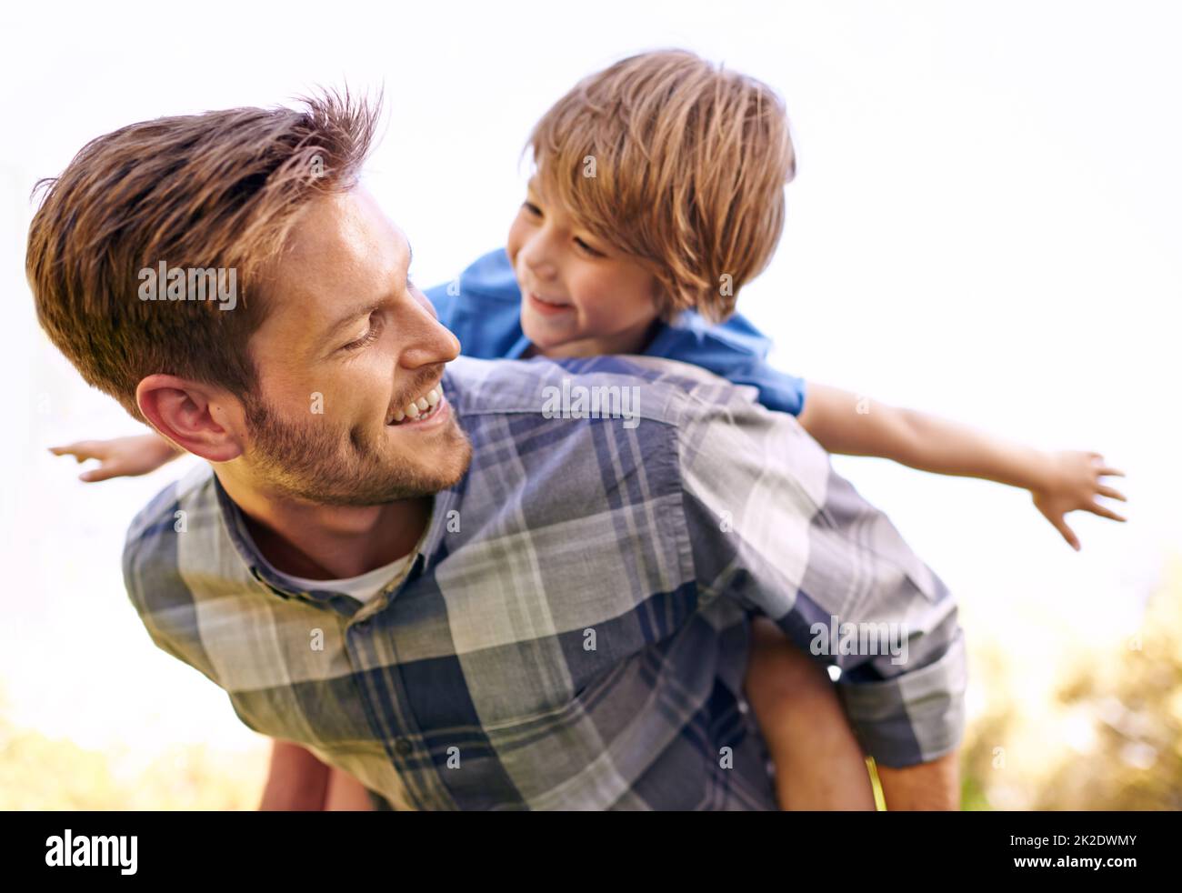 Dad giving son piggyback ride hi-res stock photography and images - Alamy