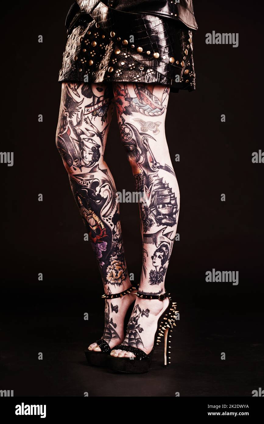 I own my style from head to toe. Studio shot of a womans tattooed legs. Stock Photo