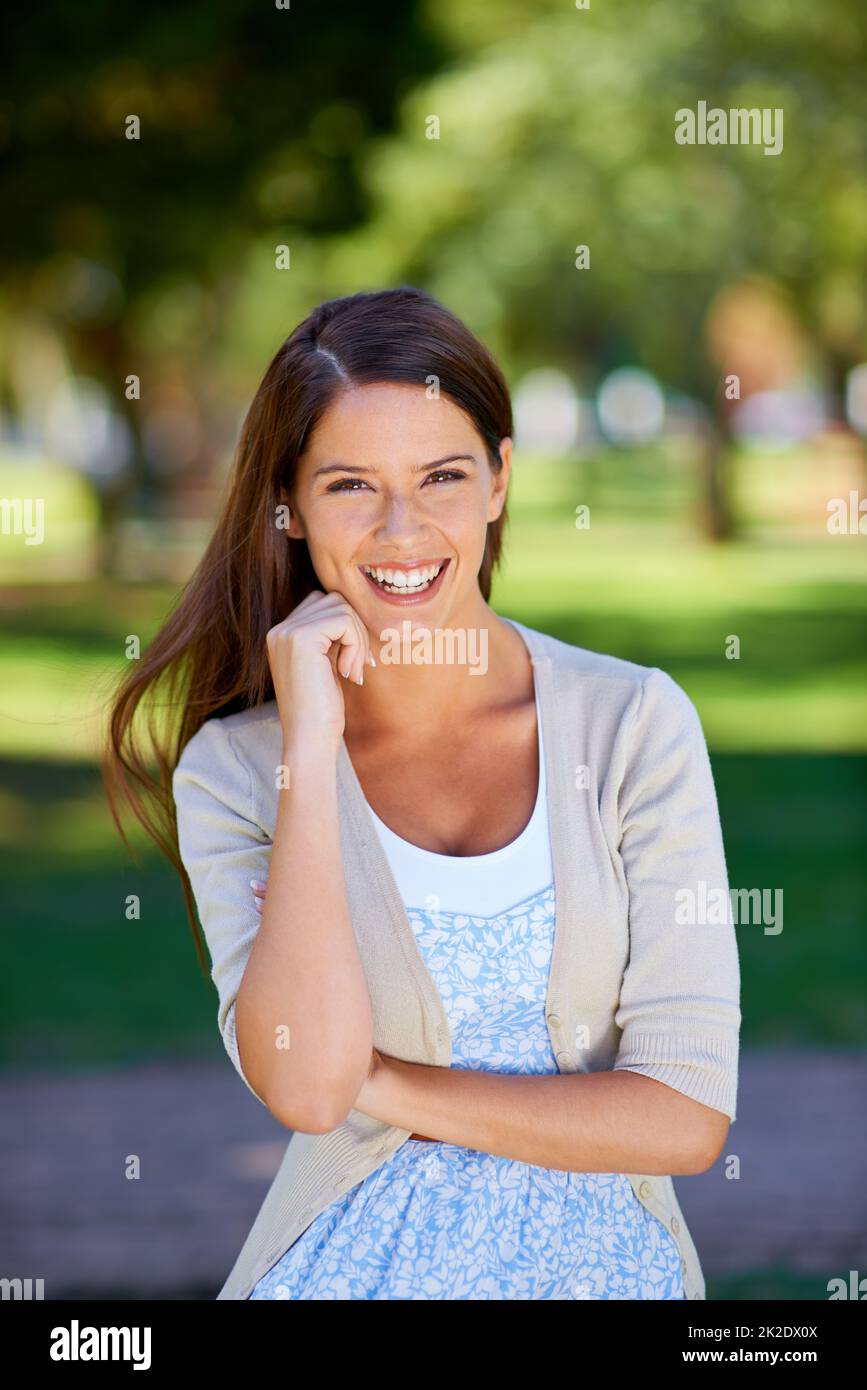 Park day pottering. Portrait of a beautiful young woman enjoying a day at the park. Stock Photo