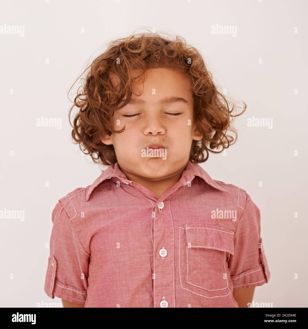 Being a kid. Shot of a cute little boy holding his breath Stock Photo Alamy