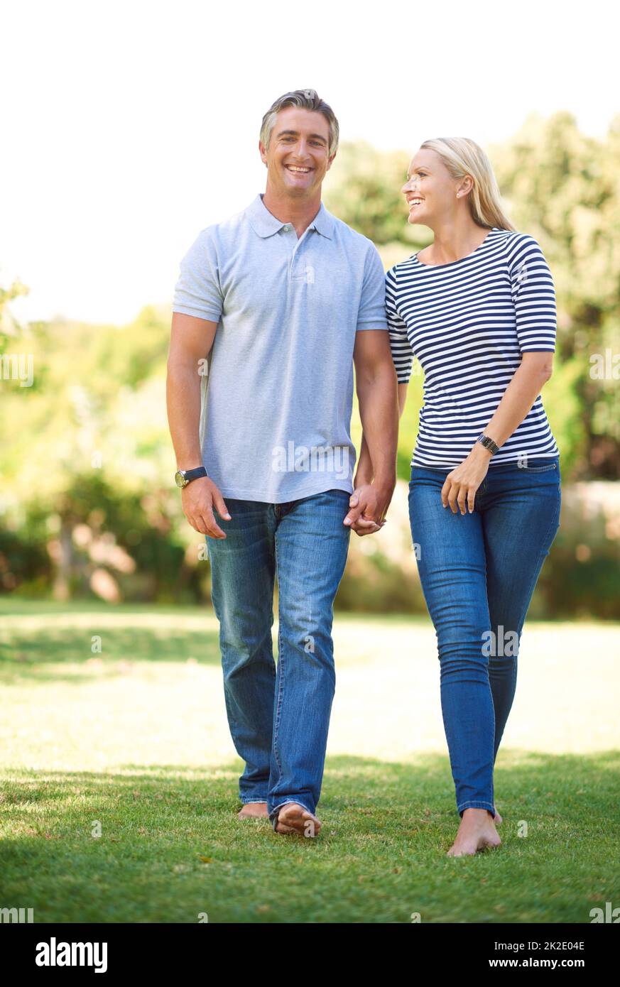 I appreciate all that you are. Full length portrait of mature couple walking hand-in-hand in the park. Stock Photo