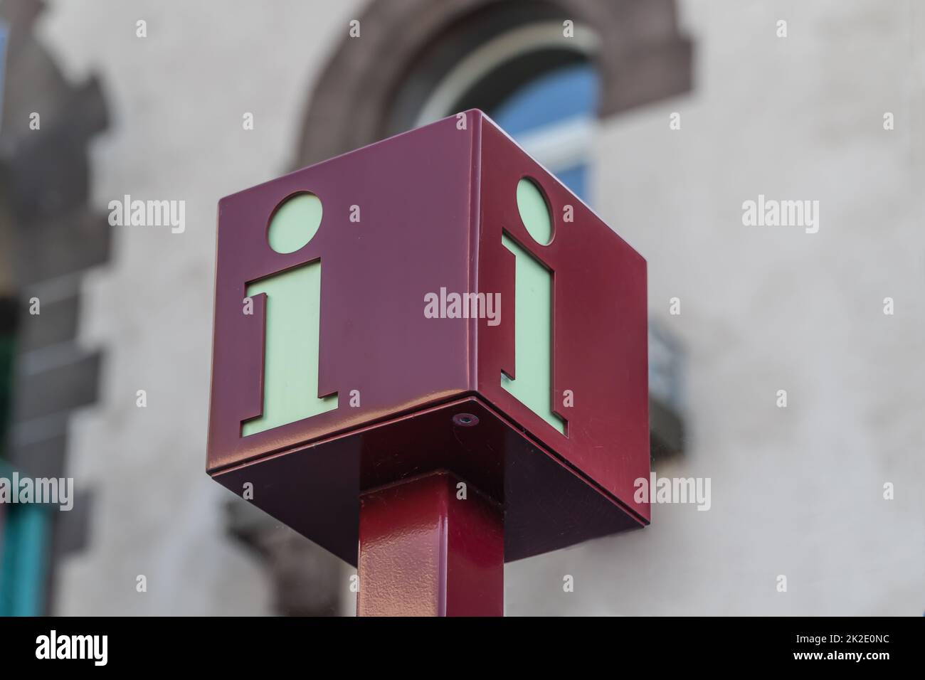 Red cube information sign helping tourist the right direction Stock Photo