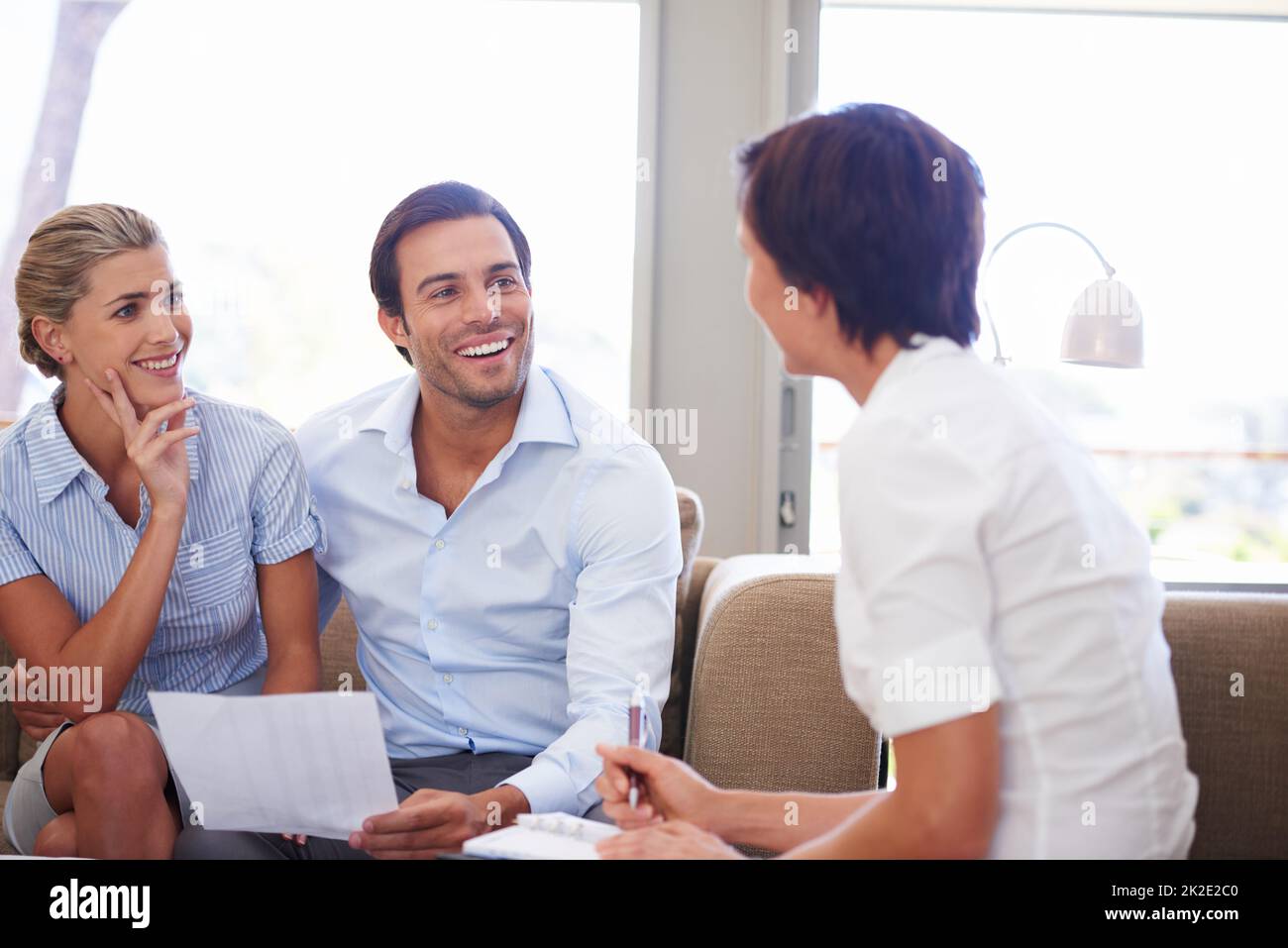 Taking charge of their finances. Shot of a couple meeting with their financial advisor. Stock Photo