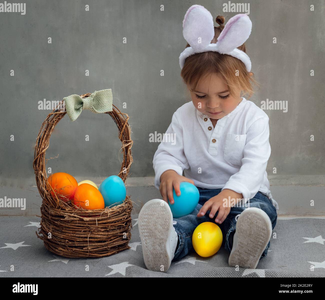 Happy Baby Boy with Easter Eggs Stock Photo